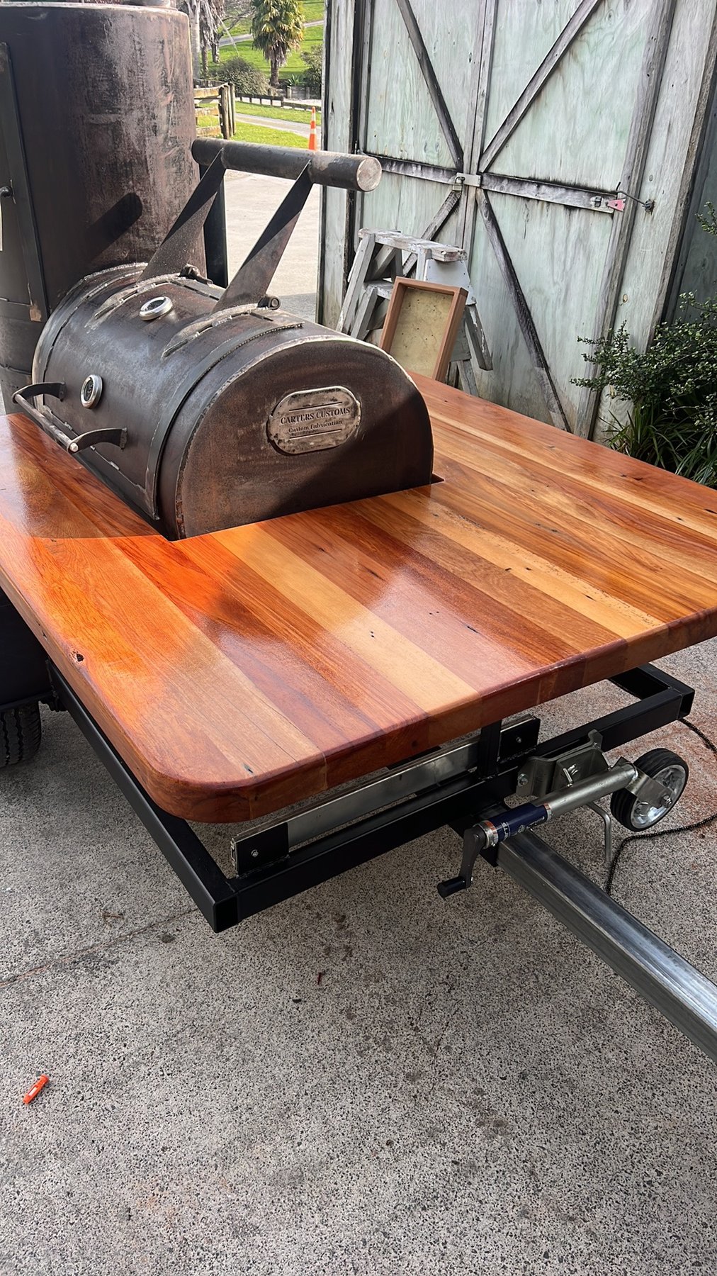 Cherry wood serving deck on a custom-built smoker